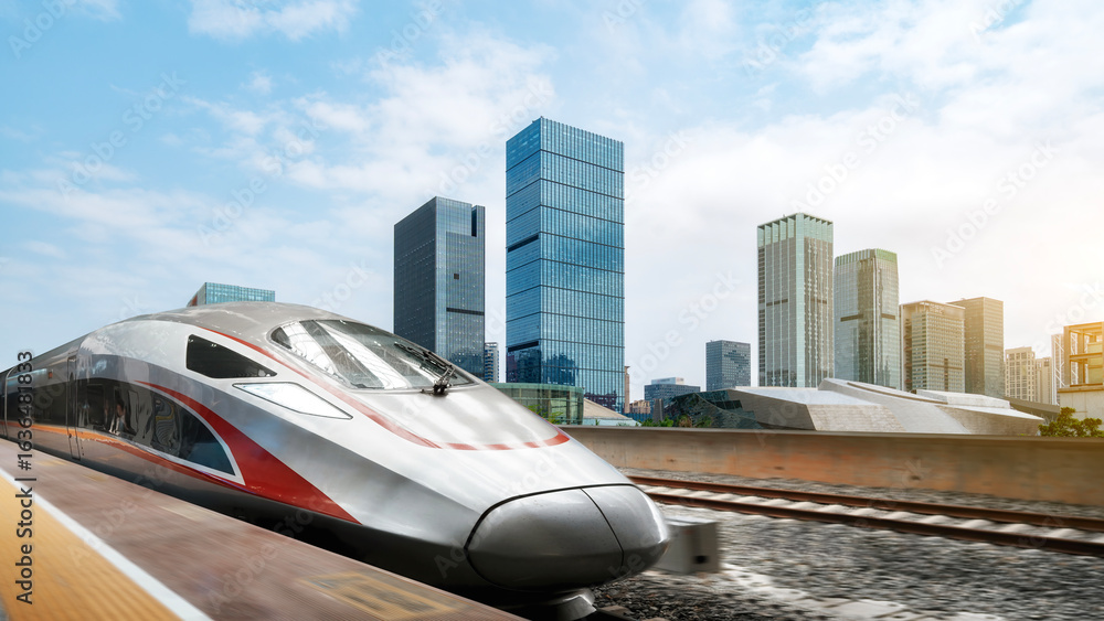 Obraz premium Modern High-Speed Train Moving Through Urban Area