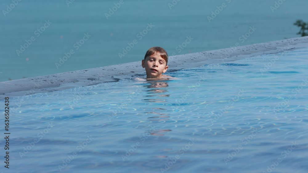 custom made wallpaper toronto digitalPreschool child in swimming pool, enjoying happy family summer vacation on the beach and in resort, swimming and playing in the water