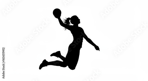 Dynamic silhouette of a female handball player in mid air action shooting the ball