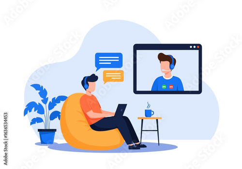 Man attending an online video conference call from home, sitting in a beanbag chair with a laptop and headset, communicating with colleagues via digital platform