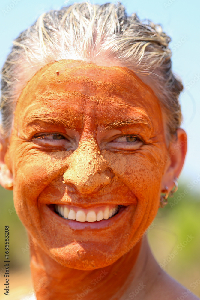Fototapeta premium Portrait of a woman with a natural clay mask. Concept: beauty