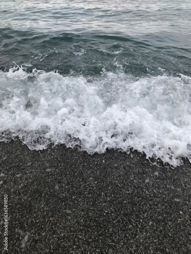 Morning waves sparkling in the Mediterranean sunlight.
