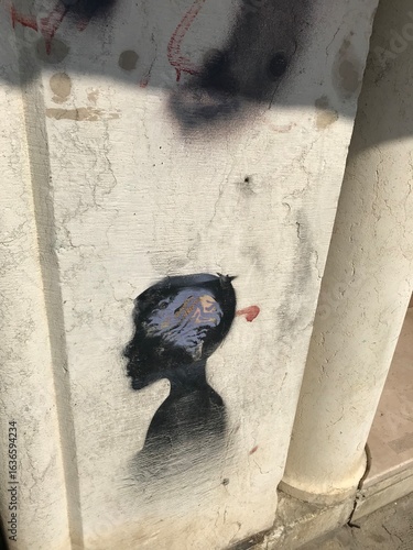 Reflections of historic buildings in calm canal waters.
