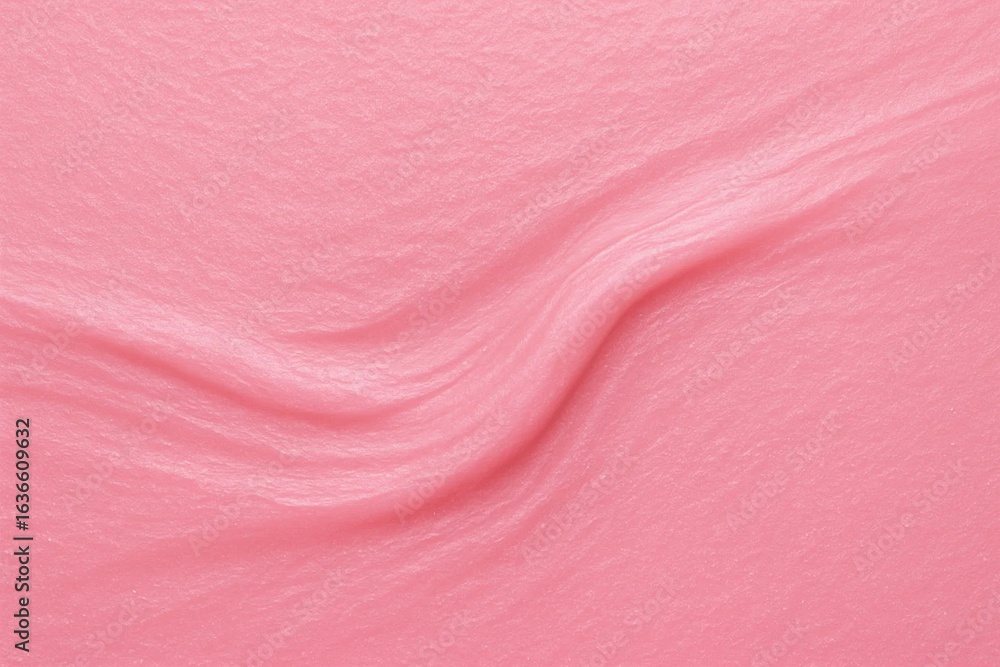 Fototapeta premium A soft, pink fabric with a subtle texture, creating a gentle wave pattern