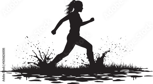Silhouette of a woman running through a muddy field with splashi