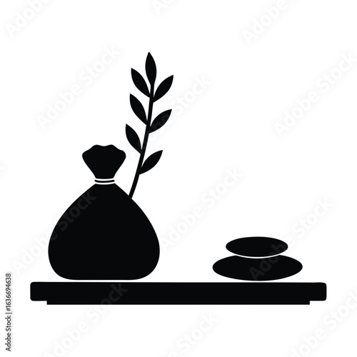 Zen spa arrangement with stones and plant silhouette