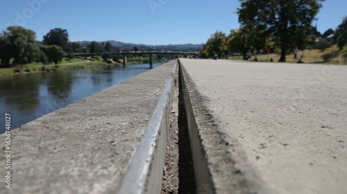 Wallpaper Mural Close-up View of Concrete Edge Near Calm Water Body in Daylight Torontodigital.ca
