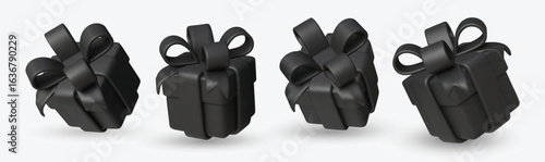 Set black gift boxes with shiny black ribbons and bows.
