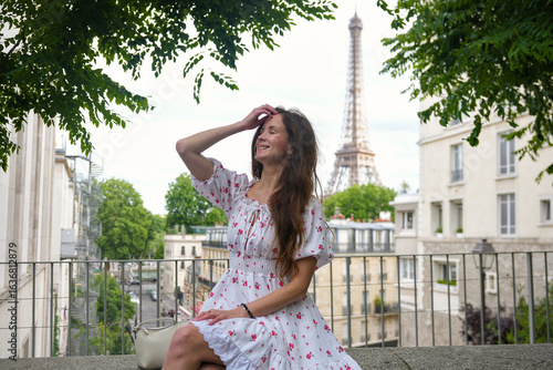 Photography Woman in summer dress near Eiffel Tower