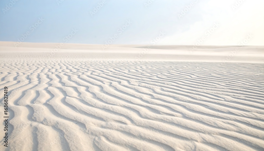 Naklejka premium Sand Dune Landscape with Ripples Under a Bright Sky