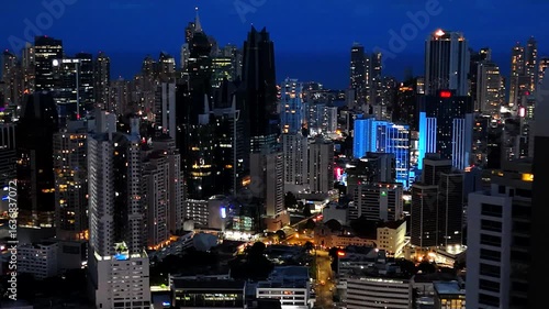 Nighttime image from a drone showing the illuminated skyline of Panama City at night, Panama City, Panama, Central America