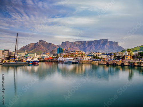 Long exposure shot of V&A Waterfront with Table Mountain at sunset, Cape Town, South Africa