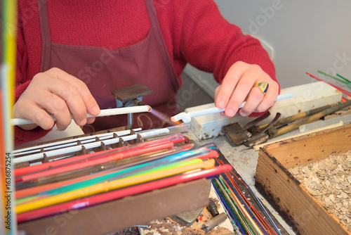 Murano glass artisan shaping glass with torch