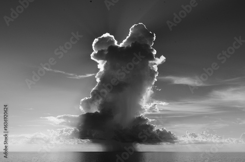 black and white lone thunderstorm at sea