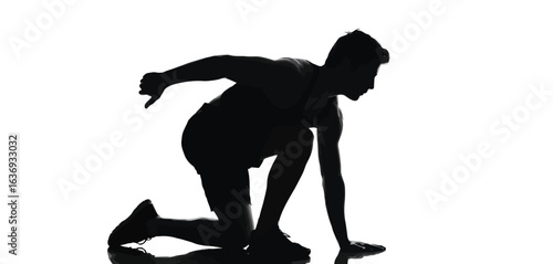 Silhouette of a runner in starting position ready to sprint