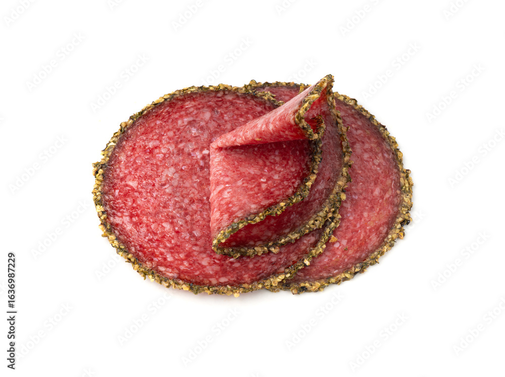 Obraz premium Pepper salami cuts isolated, thin sausage slices. Sliced dry chorizo, sausages round pieces