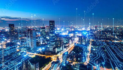 Digital city at night: Futuristic cityscape with data streams and network connections