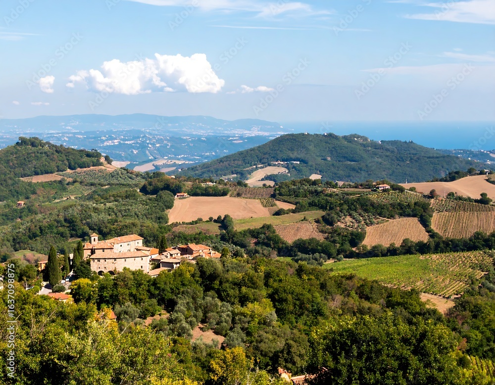 Fototapeta premium Panoramic view of Italian countryside with villages, hills, vineyards, and coastline