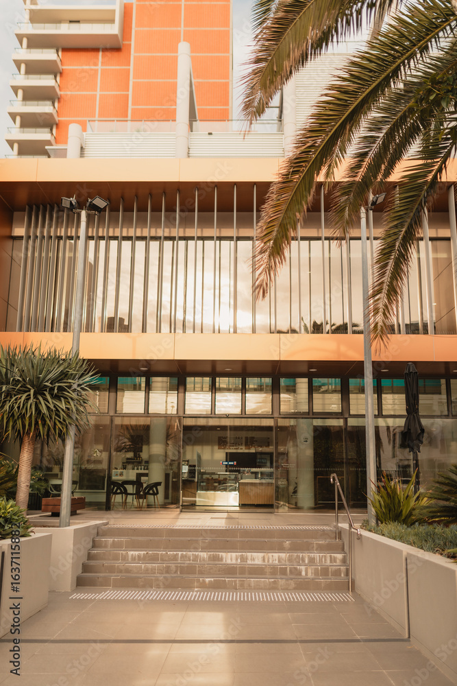 Fototapeta premium Modern office building with cafe on ground floor
