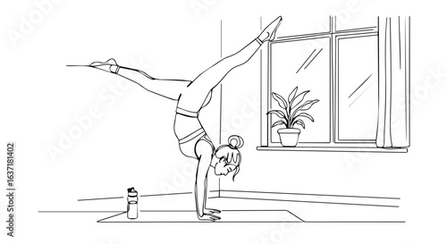 Fitness at home handstand exercise. Woman doing handstand near window in home gym. Fitness at home workout for strength and flexibility. Fitness at home routine for healthy lifestyle.