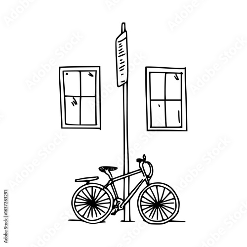 a bicycle parked on a street with windows and a lamppost