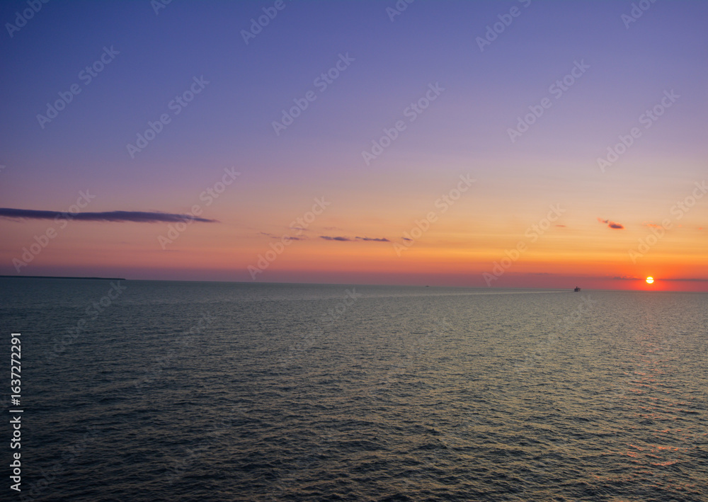 Fototapeta premium vibrant sunset over the Baltic Sea off the coast of Riga, Latvia