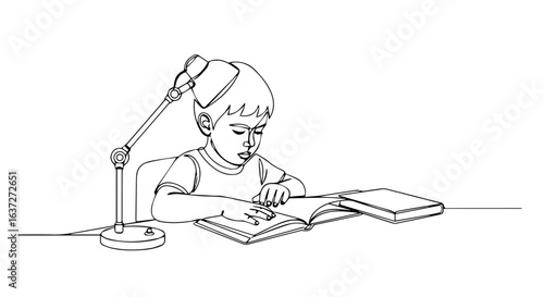 Child reading book at desk with lamp.  Young boy focused on his studies.  Homework help for elementary school student.  Concept image for educational resources and learning.