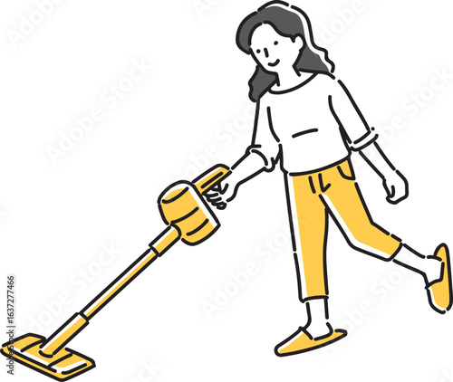 ハンディクリーナーで掃除をする女性