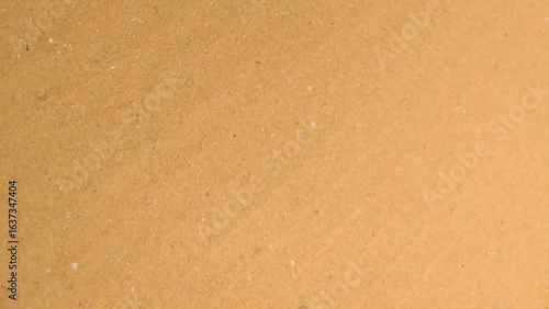 Background of brown kraft paper or cardboard texture. Abstract pattern of beige rough carton,