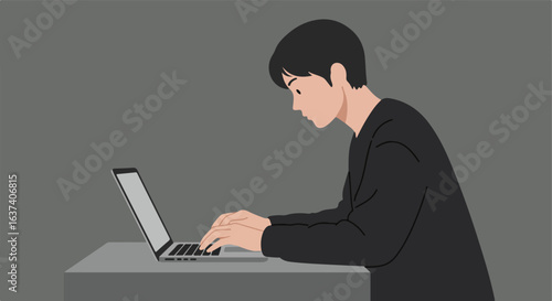Person working at laptop on a gray background. Dark hair, dark clothing, neutral desk