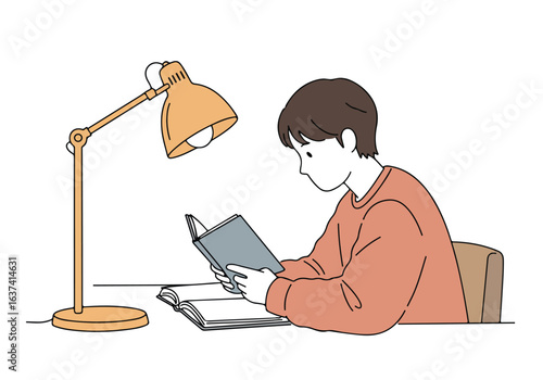 Boy reads book on desk under lamp, studying, learning concept, education promotion use