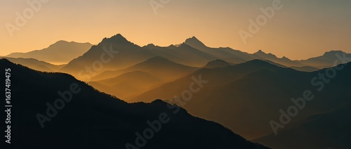 Silhouette mountain range at sunrise
