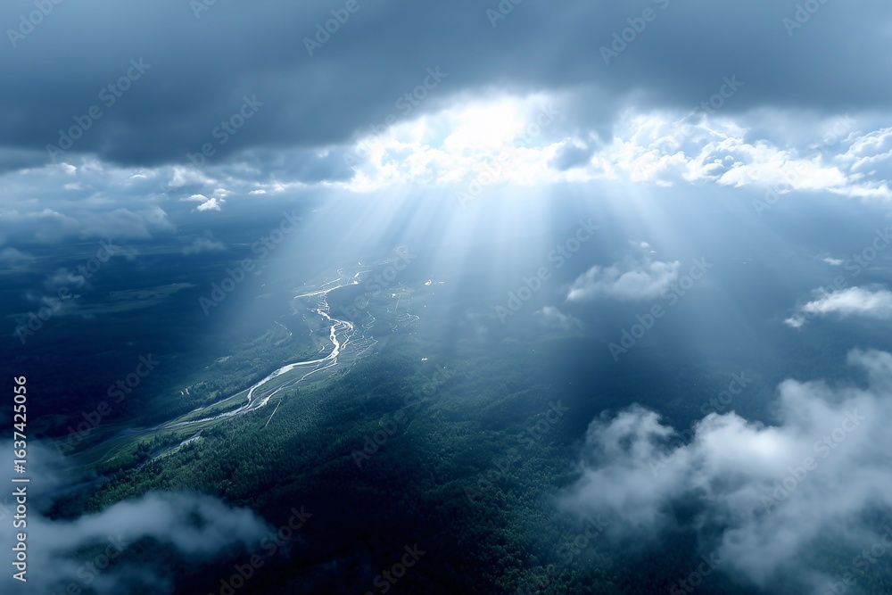 Naklejka premium sun rays streaming through clouds over winding river, vast forest landscape beneath, aerial view for dramatic scenery