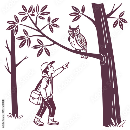 Young boy wearing a cap and carrying a satchel points excitedly at an owl perched on a tree branch