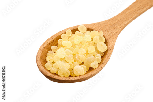 closeup pile of mastic gum or tear of chios in wood spoon cutout
