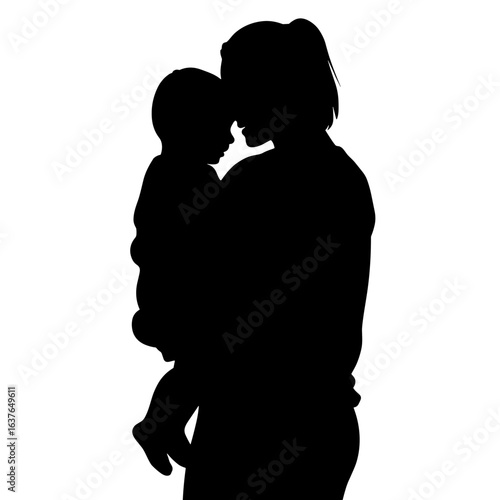 Silhouette of mother holding baby, showing maternal affection in black and white. This mother and child silhouette is a simple but powerful image of love.