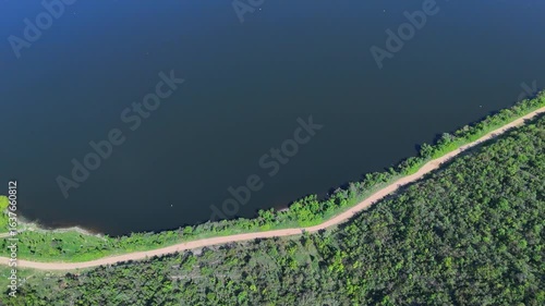 Borderline Beauty: Dynamic Drone Pan Over Boğazköy Dam Lake, Forest, and Dirt Road in İnegöl, Bursa.