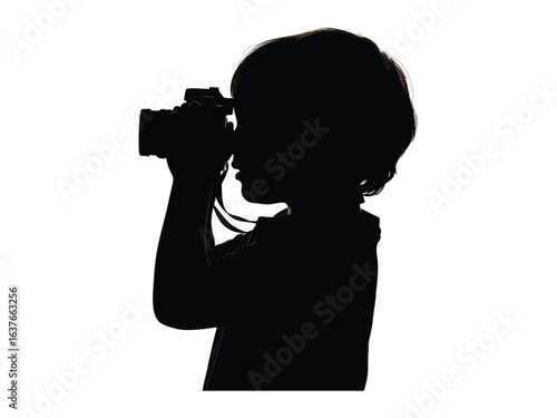 Silhouette of Budding Photographer: Capturing the essence of childhood curiosity, a young child stands focused, peering through the lens of a camera, igniting the spark of creativity. 