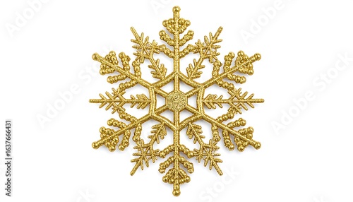 Ornate gold snowflake decoration isolated on white