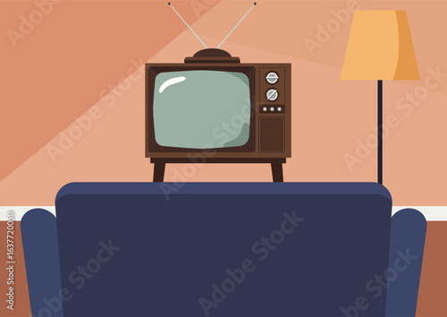 An old television with rabbit ears facing a couch in a living room setup. Retro media entertainment. Nostalgic television viewing.