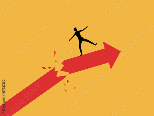 Businessman on a broken arrowhead