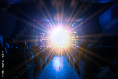 Bright light display captivates audience during evening performance in an indoor venue