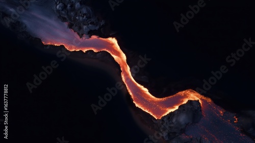 Aerial Drone View of Slow-Moving Lava River Flowing Through Dark Volcanic Landscape