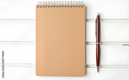 Wallpaper Mural Tan Notebook and Brown Pen on White Wooden Table. High quality Torontodigital.ca