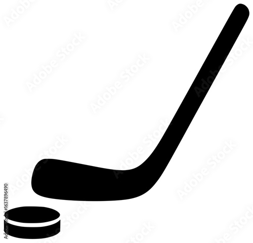 Hockey player scores goal with hockey puck flying through air and goalie making save