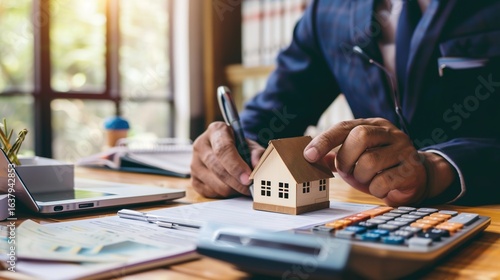 Real estate agents calculate mortgage loans and financing plans for clients.