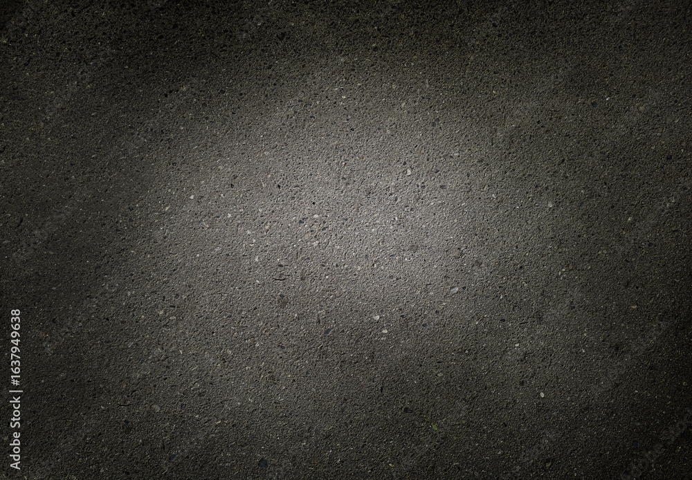 Fototapeta premium background texture of dark asphalt with a light spot in the middle