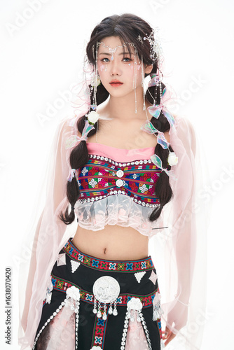 An Eastern girl dressed in the traditional costume of the Hani ethnic minority, which is popular among online influencers.