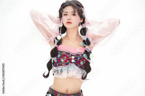 An Eastern girl dressed in the traditional costume of the Hani ethnic minority, which is popular among online influencers.