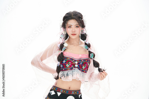 An Eastern girl dressed in the traditional costume of the Hani ethnic minority, which is popular among online influencers.